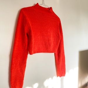 cropped orange sweater